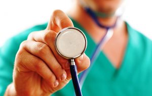 Doctor holding stethoscope